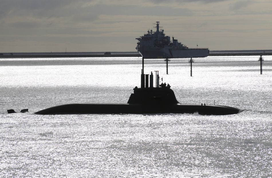 Submarine and a warship on Plymouth Sound, UK